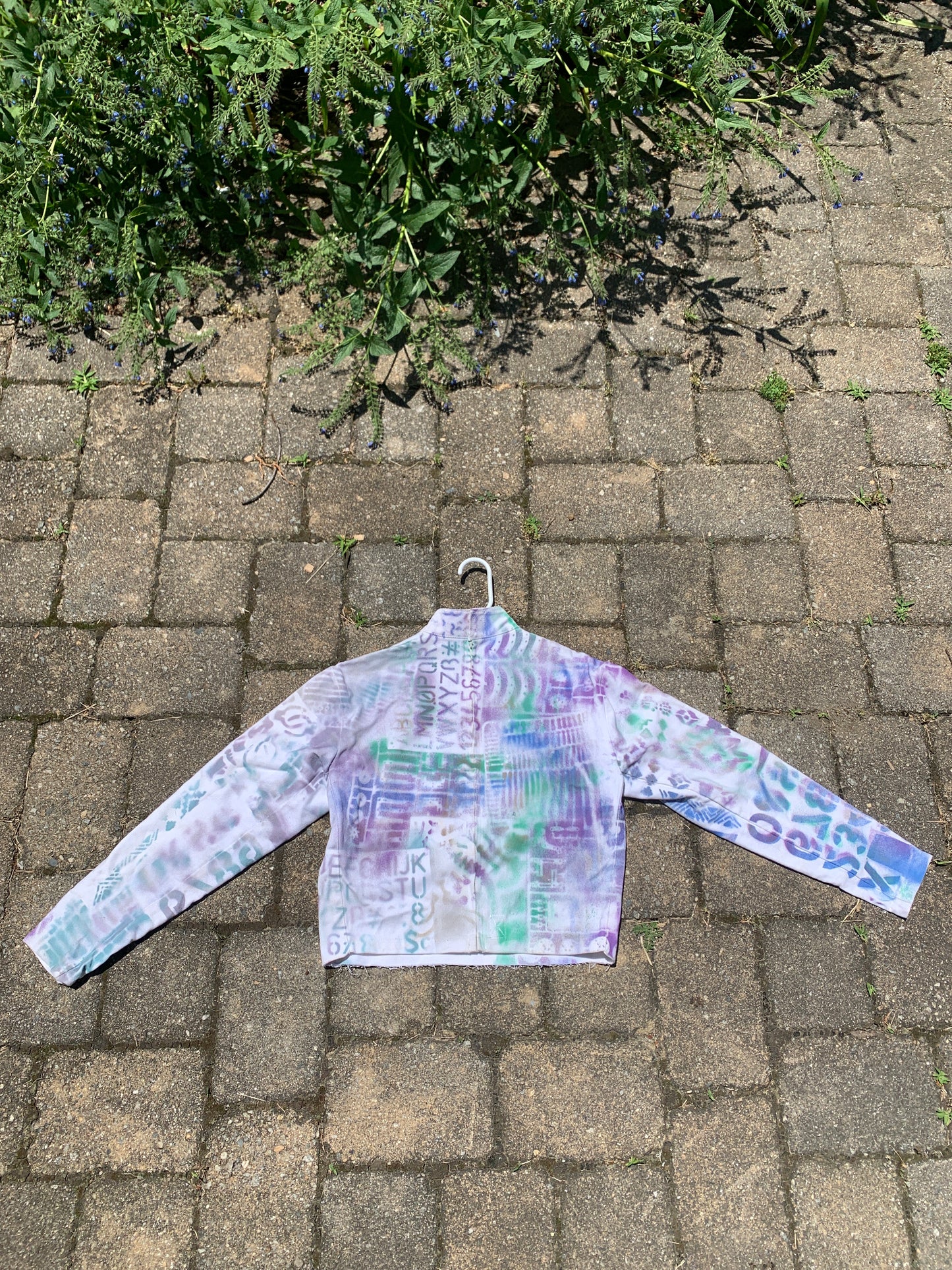 Spray painted fencing jacket